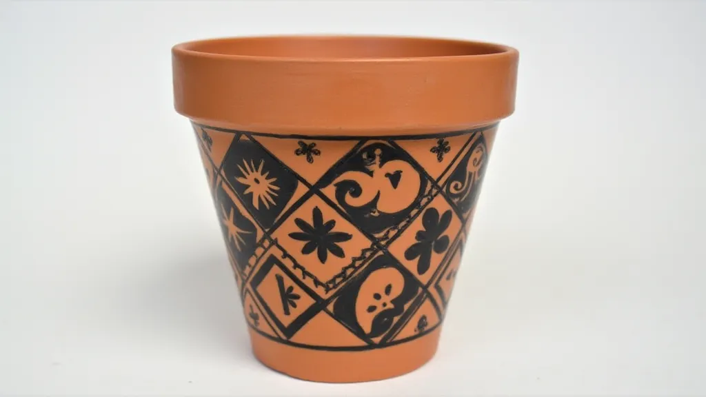 Terracotta flower pot with geometric pattern